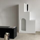 Black solid monoxyl wood bench carved into 3 arches