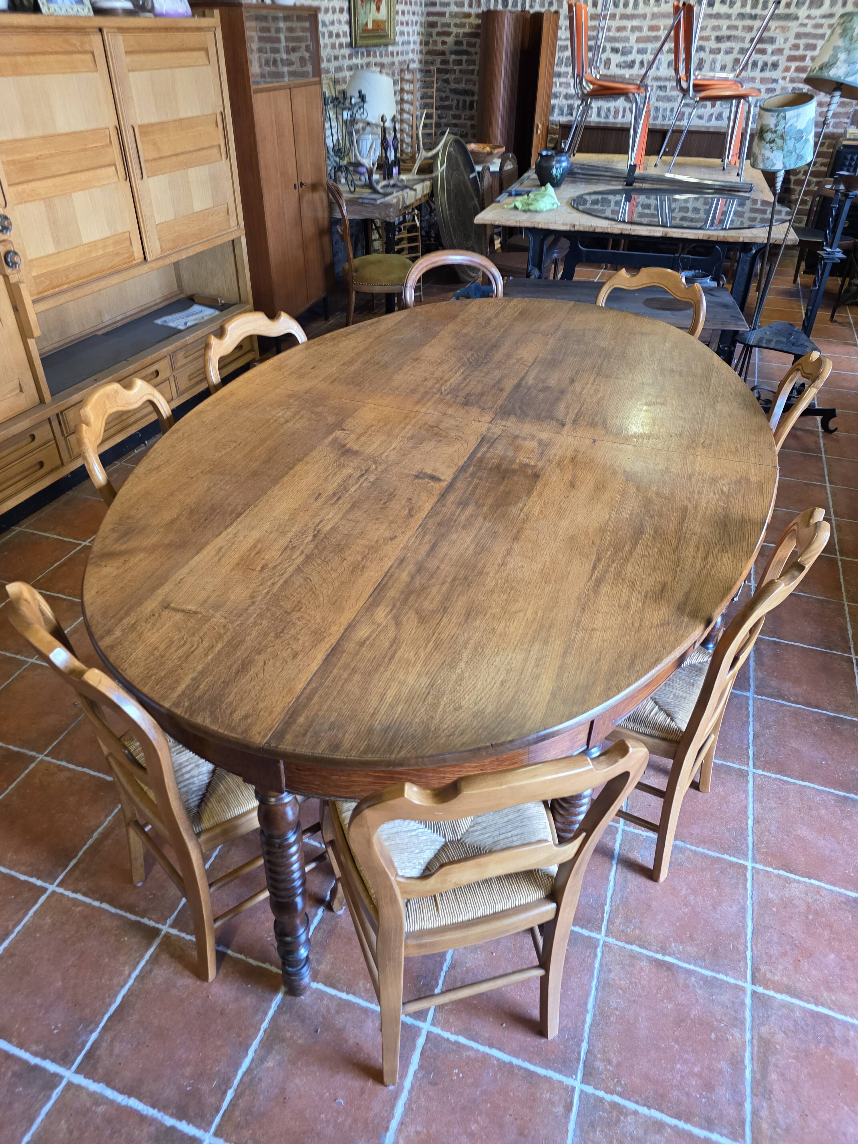 Large oval farmhouse table in solid oak, 19th century, 243 × 153cm