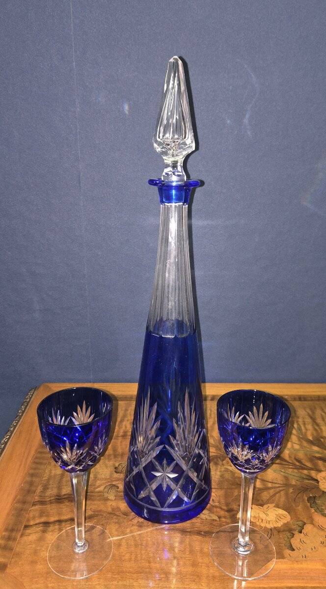 Cobalt blue double crystal service, consisting of a decanter and two matching glasses.
