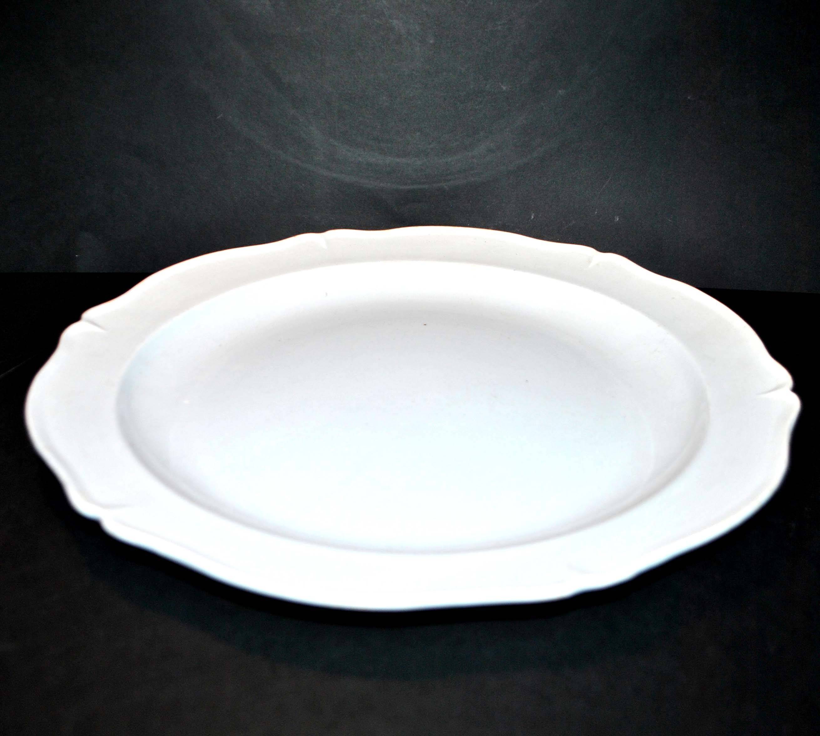 Large round dish in opaque earthenware from Montereau 1820-1830 Pastel blue 32cm