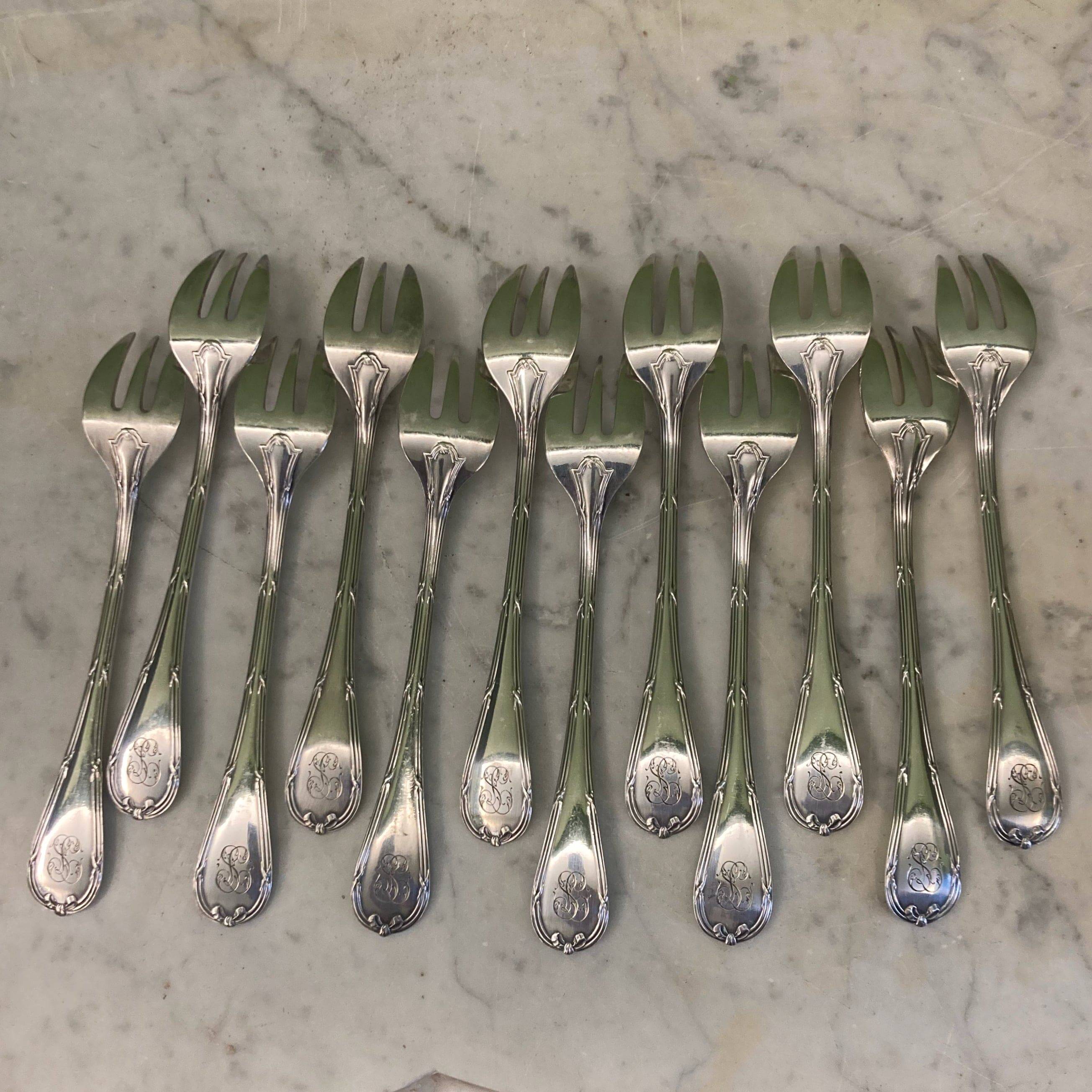 Christofle house 12 crossed ribbon oyster forks
