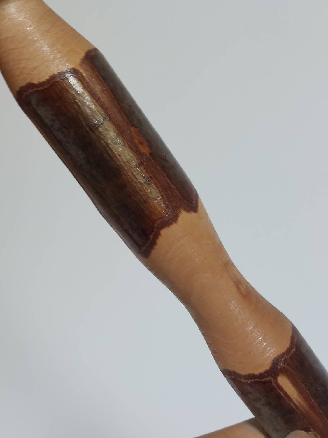 Pair of walnut stools sculpted in a vintage mid-century cross-section.