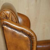 Captain's chair Chesterfield vintage leather with tufted wingback.