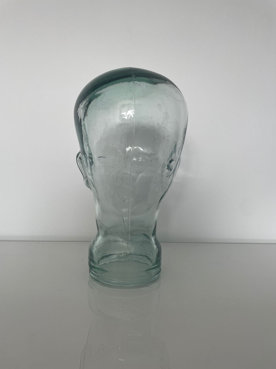 Mannequin head with glass hat