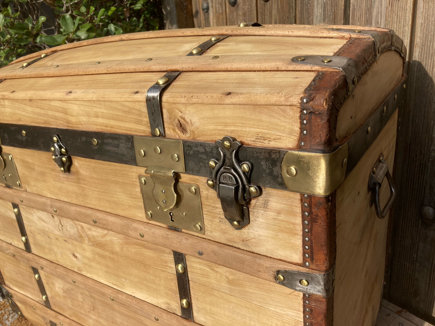 Exceptional curved leather/brass box with beautiful restored clasps.