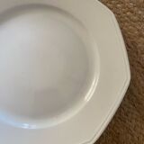 5 mismatched old white plates.