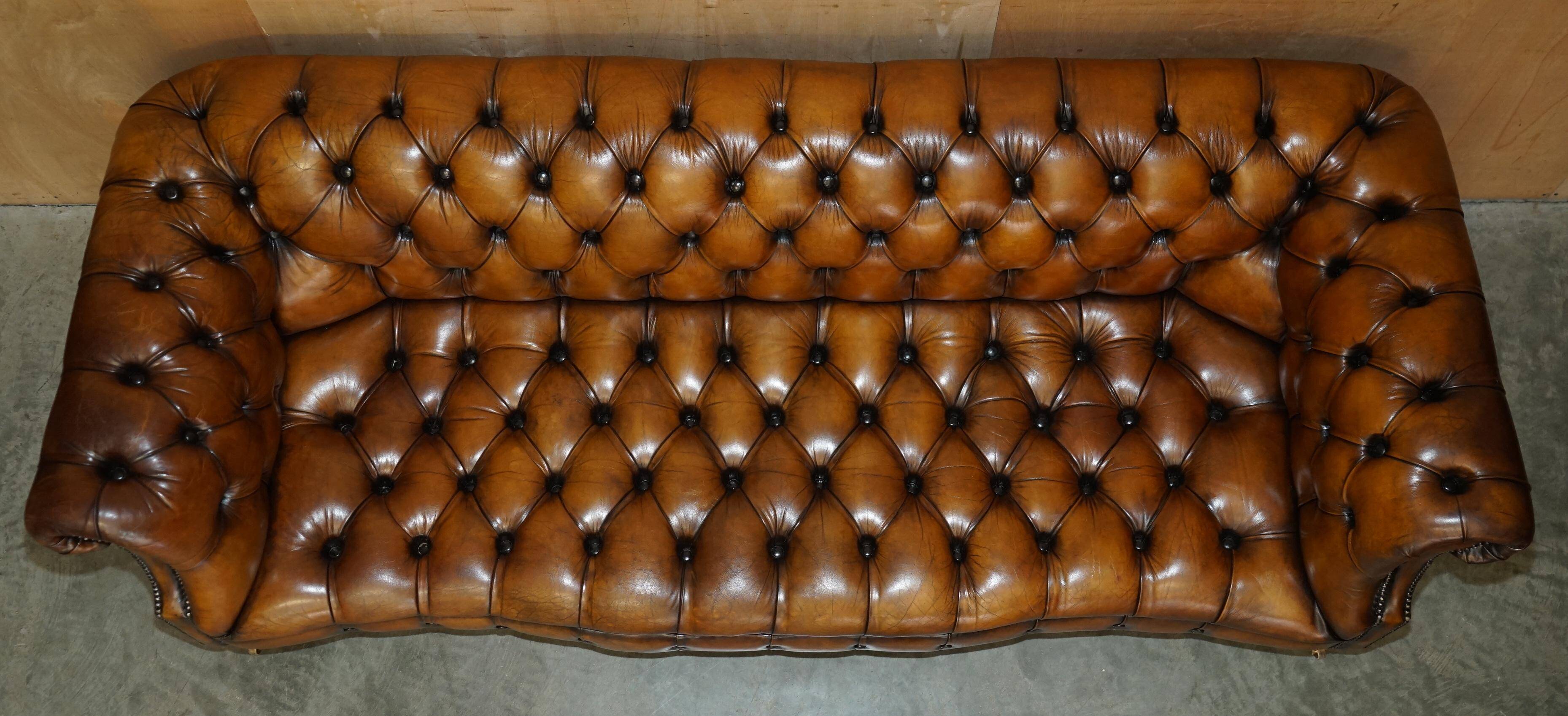 Vintage Chesterfield serpentine luxury sofa in restored leather