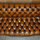 Vintage Chesterfield serpentine luxury sofa in restored leather