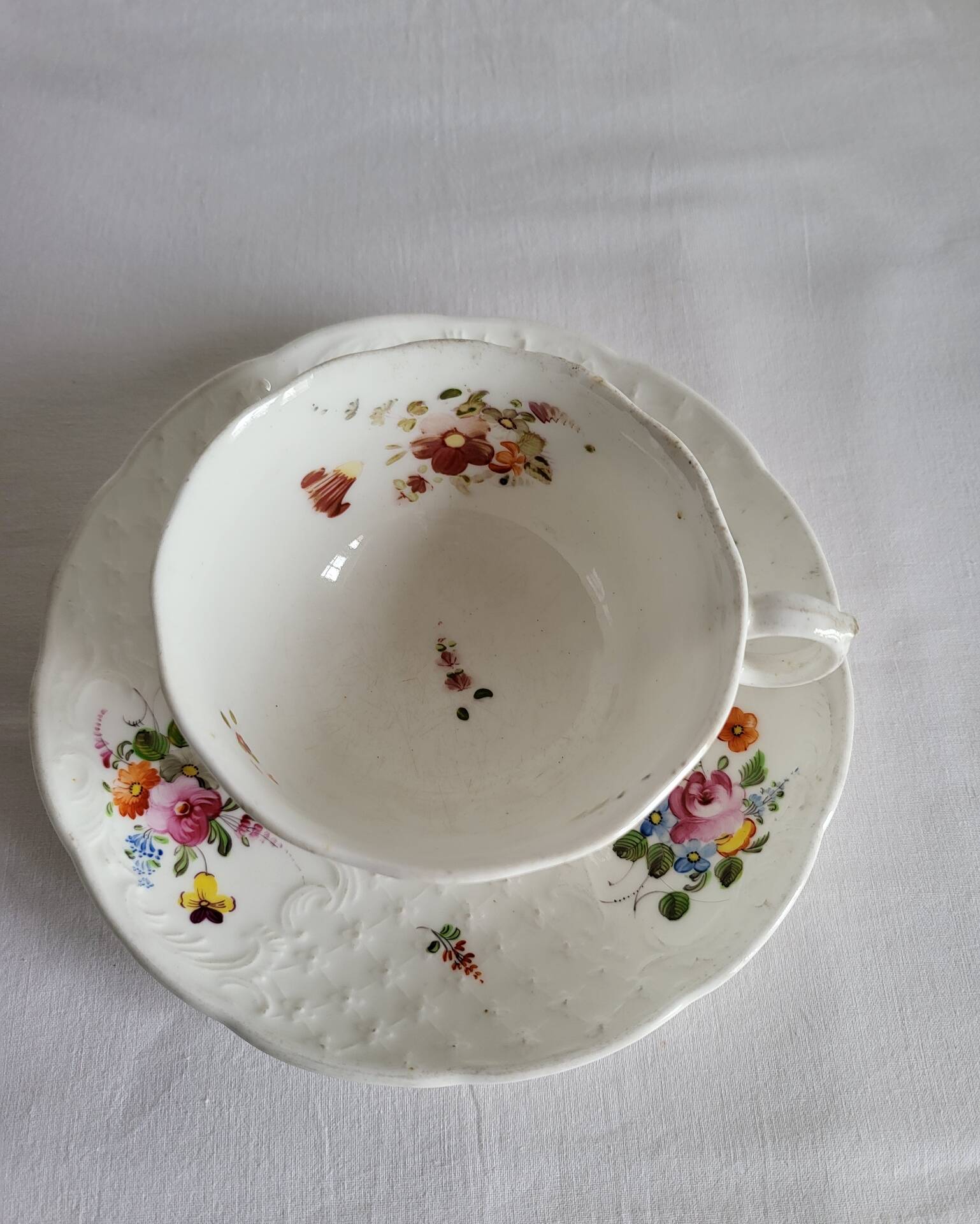 Antique Cup and Saucer in Porcelain with Hand-Painted Floral Decoration