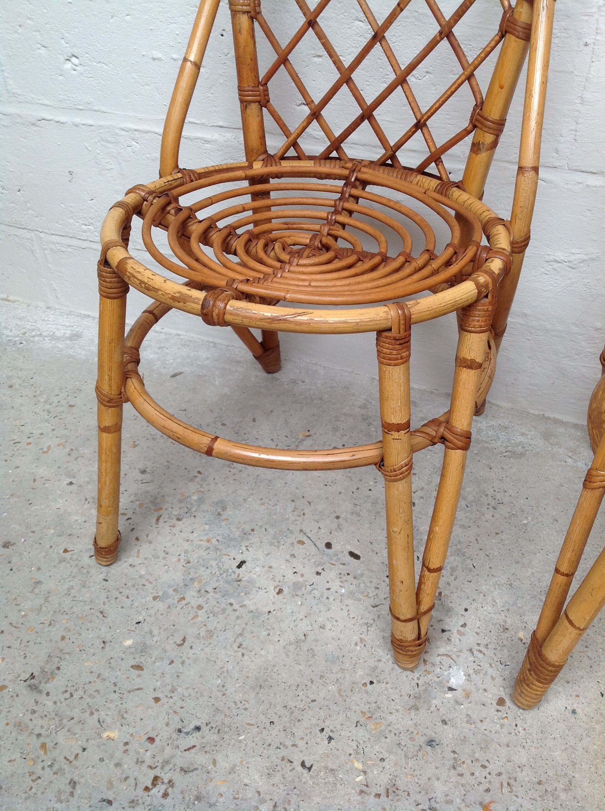 Pair of rattan chairs by Louis Sognot
