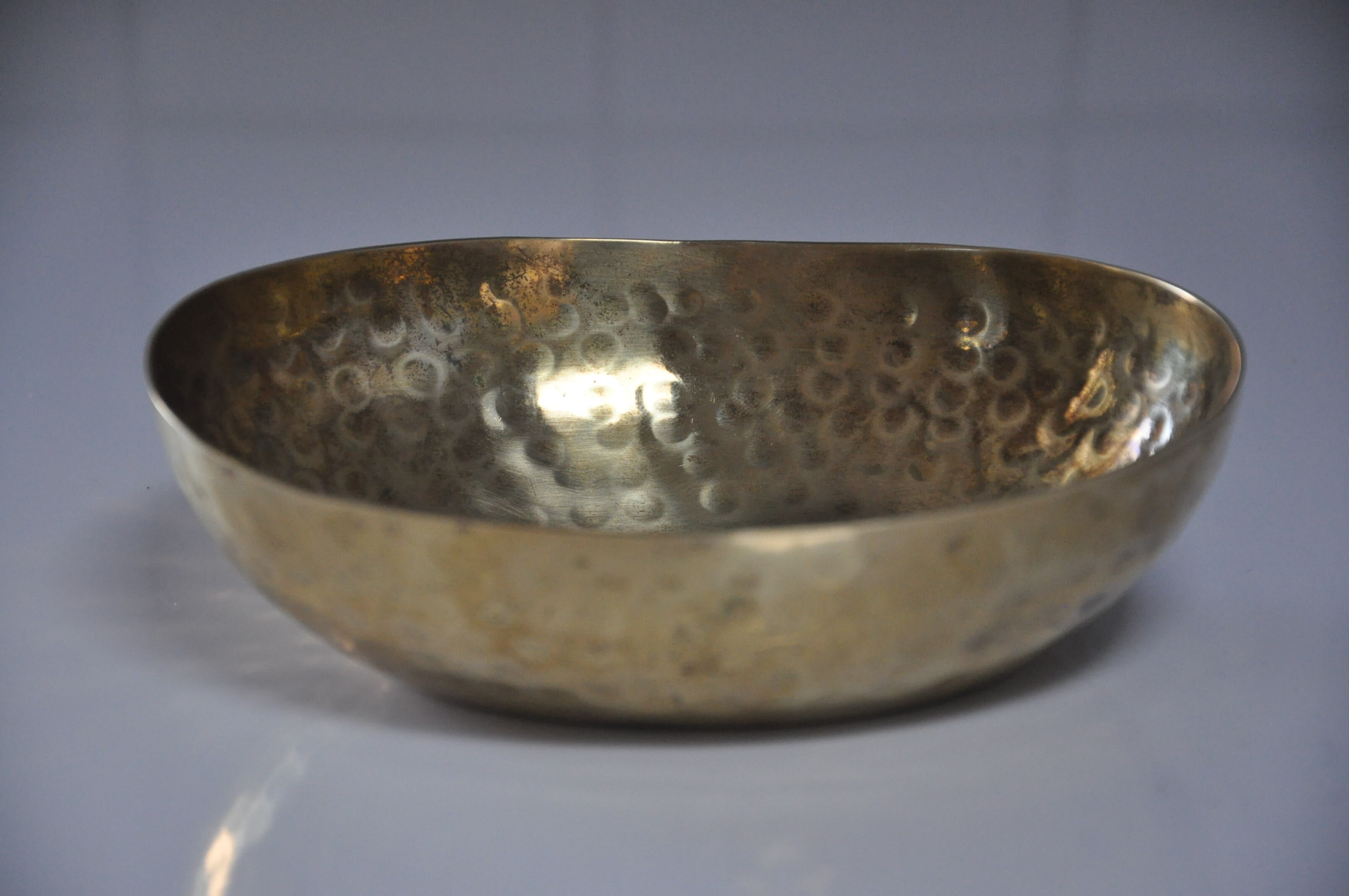 Empty hammered brass pocket