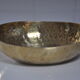 Empty hammered brass pocket