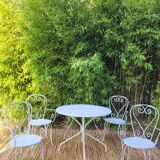 Renovated round table and garden armchairs