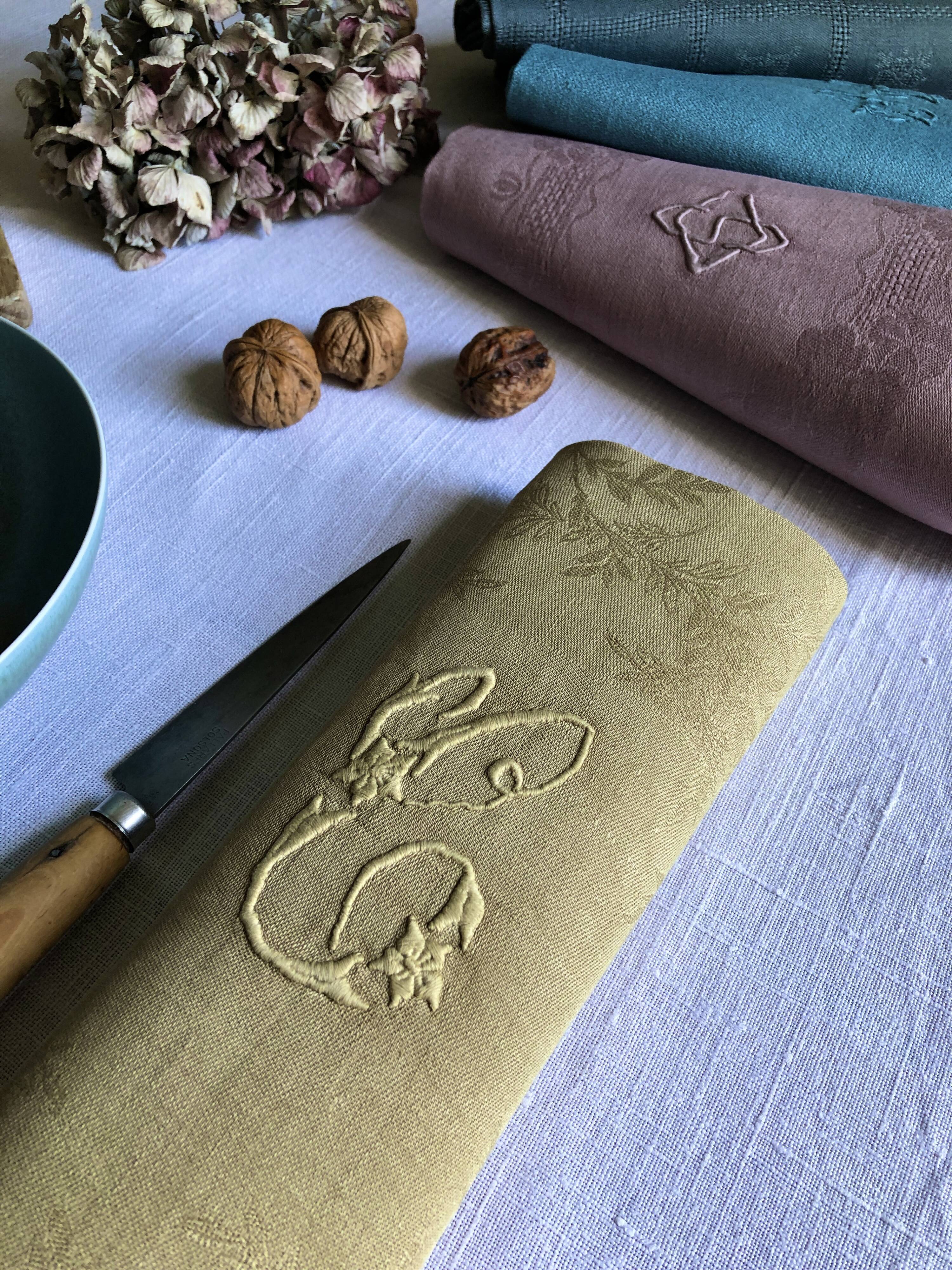 Suite of four tinted antique napkins