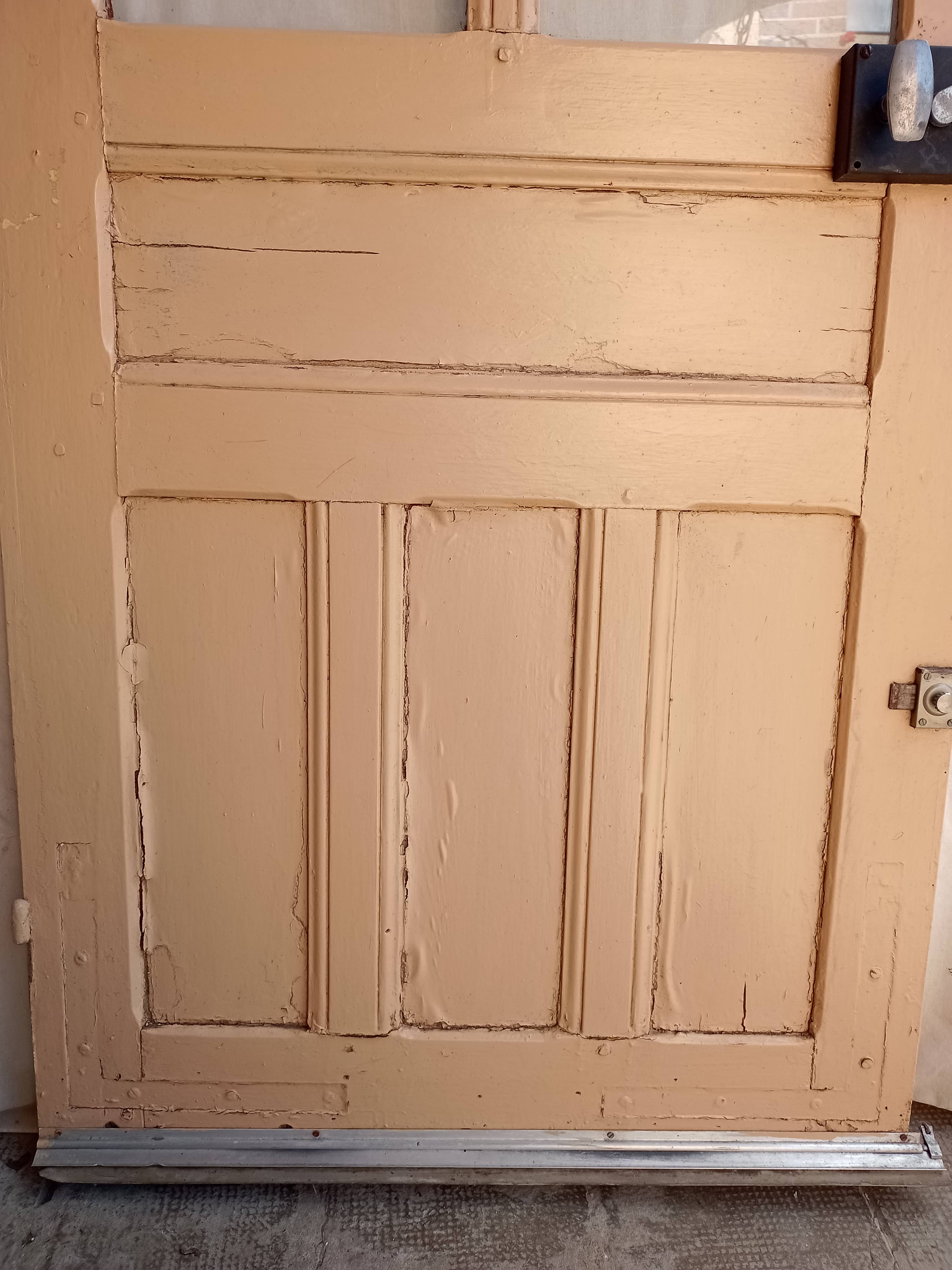 Old glazed door with its shutter