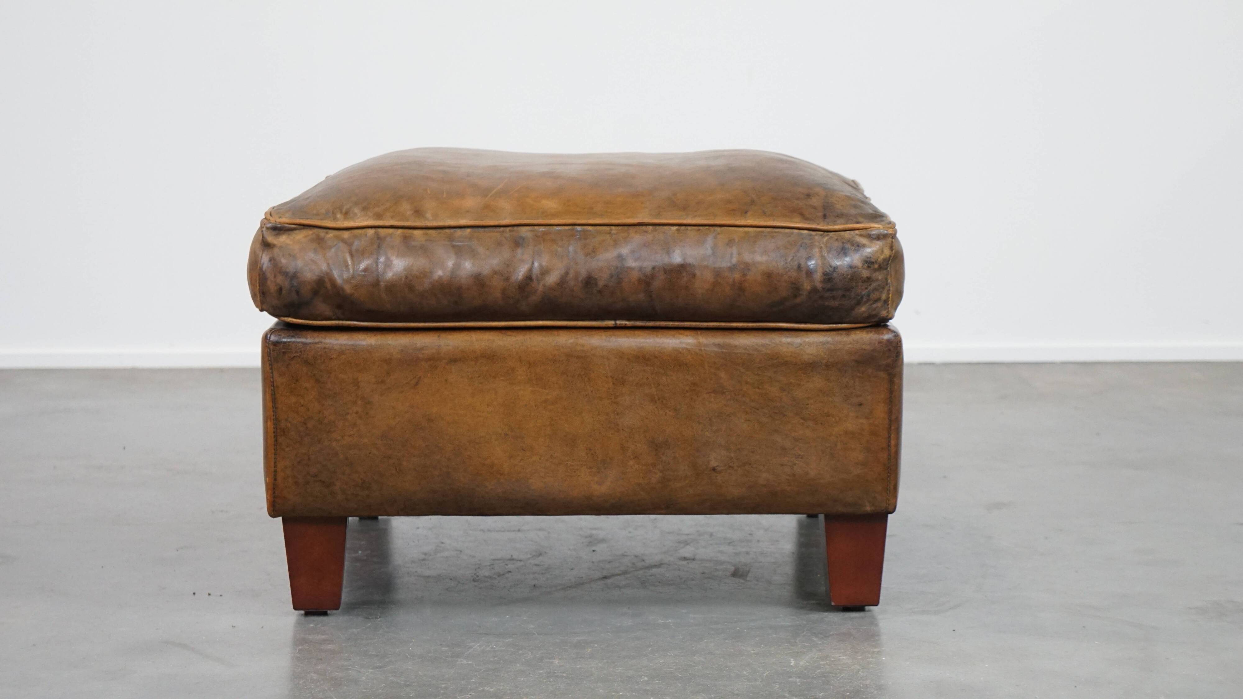 Sheepskin wing chair + XXL patinated footrest