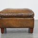 Sheepskin wing chair + XXL patinated footrest