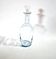 Old blue-tinted glass bottle carafe