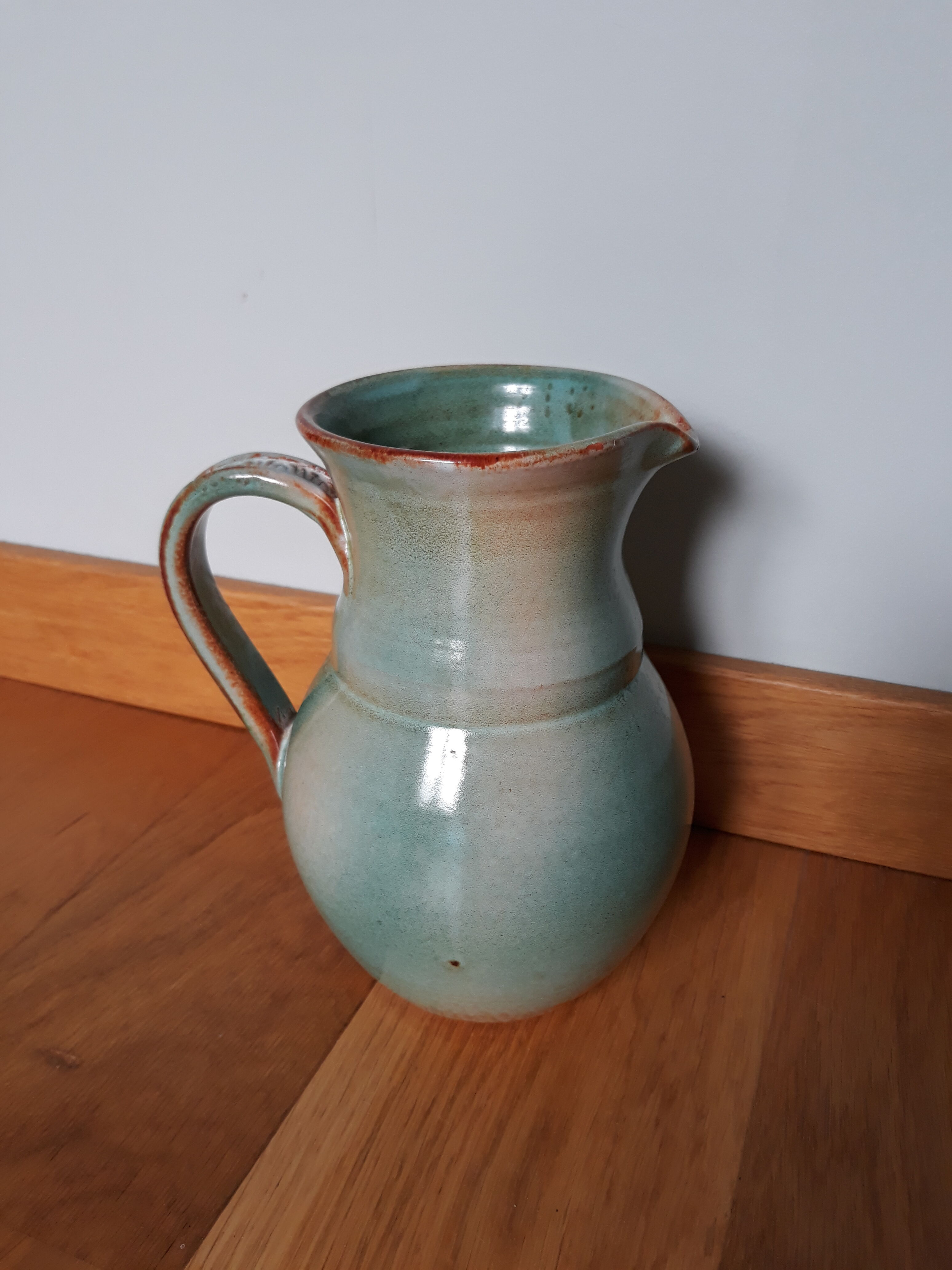 Pitcher with handle green celadon turquoise and caramel