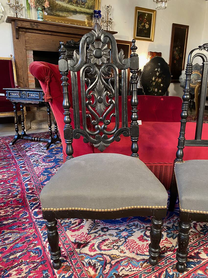 Fake pair of low Napoleon III chairs in blackened wood.