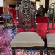 Fake pair of low Napoleon III chairs in blackened wood.