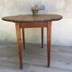 Table ronde à 2 rabats en bois vintage