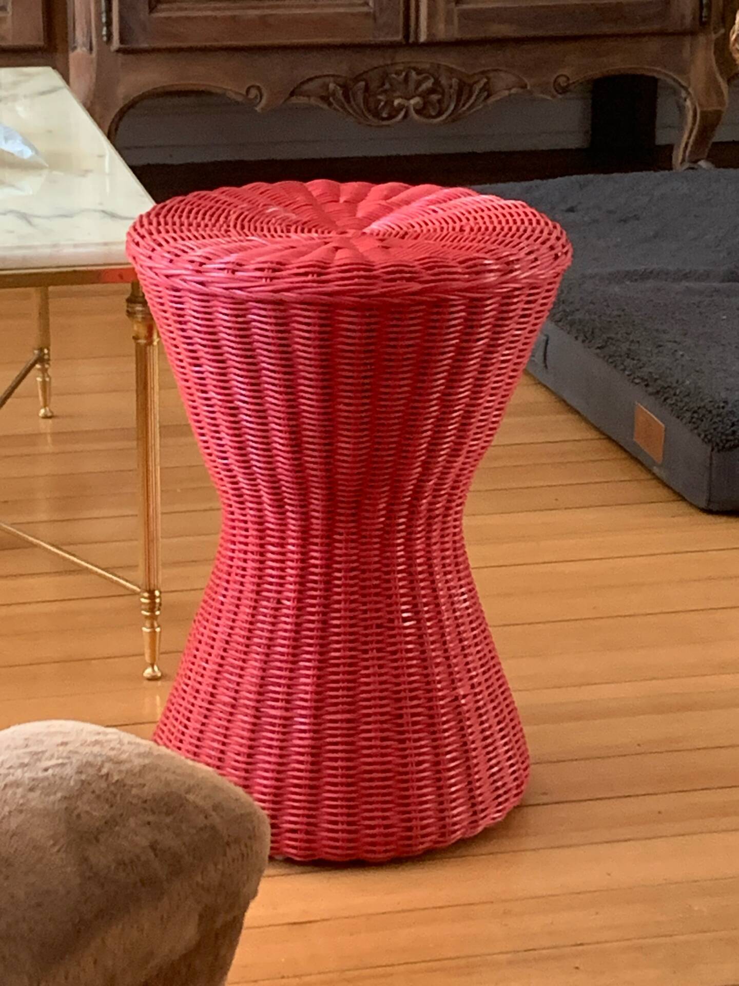 Vintage hourglass stool in red wicker or woven rattan.