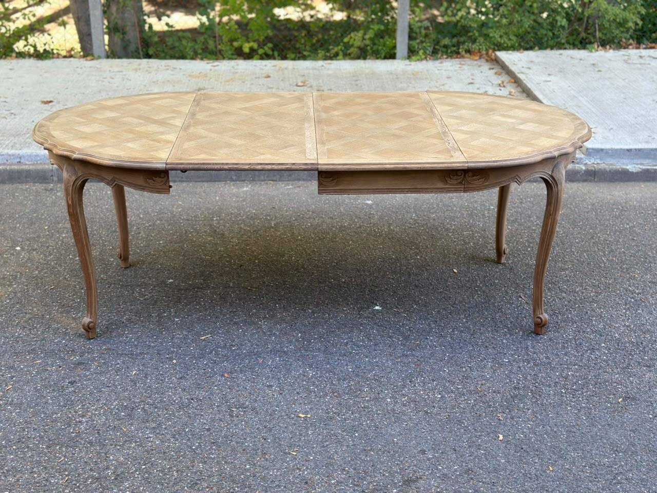 Round extendable dining table Louis XV stripped in solid oak 1950