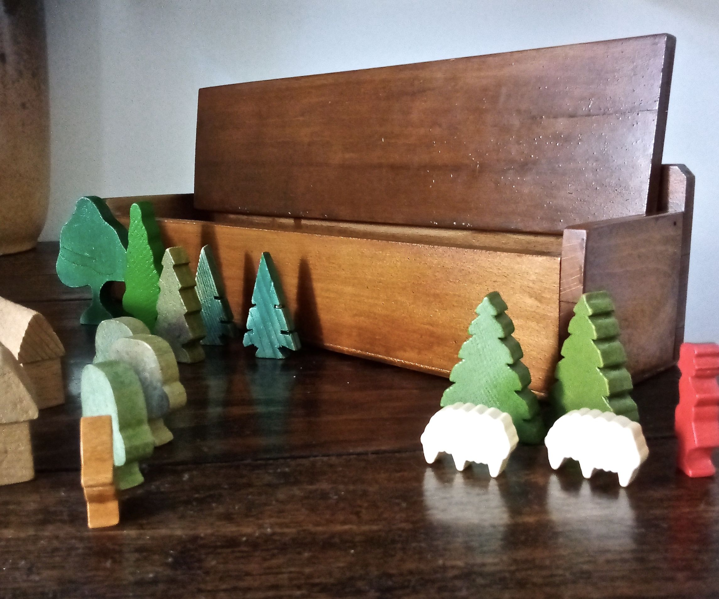 Village small farm wood painted with animals and characters stored in a large old box.