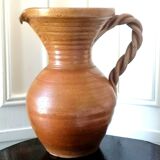 Sandstone jug with twisted handle