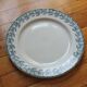 Plat rond en terre de fer décor iris Badonviller
