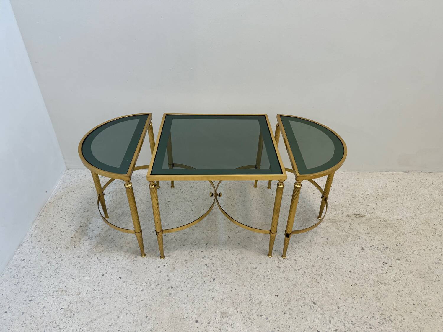 Neo classic coffee table in brass and smoked glass