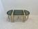Neo classic coffee table in brass and smoked glass