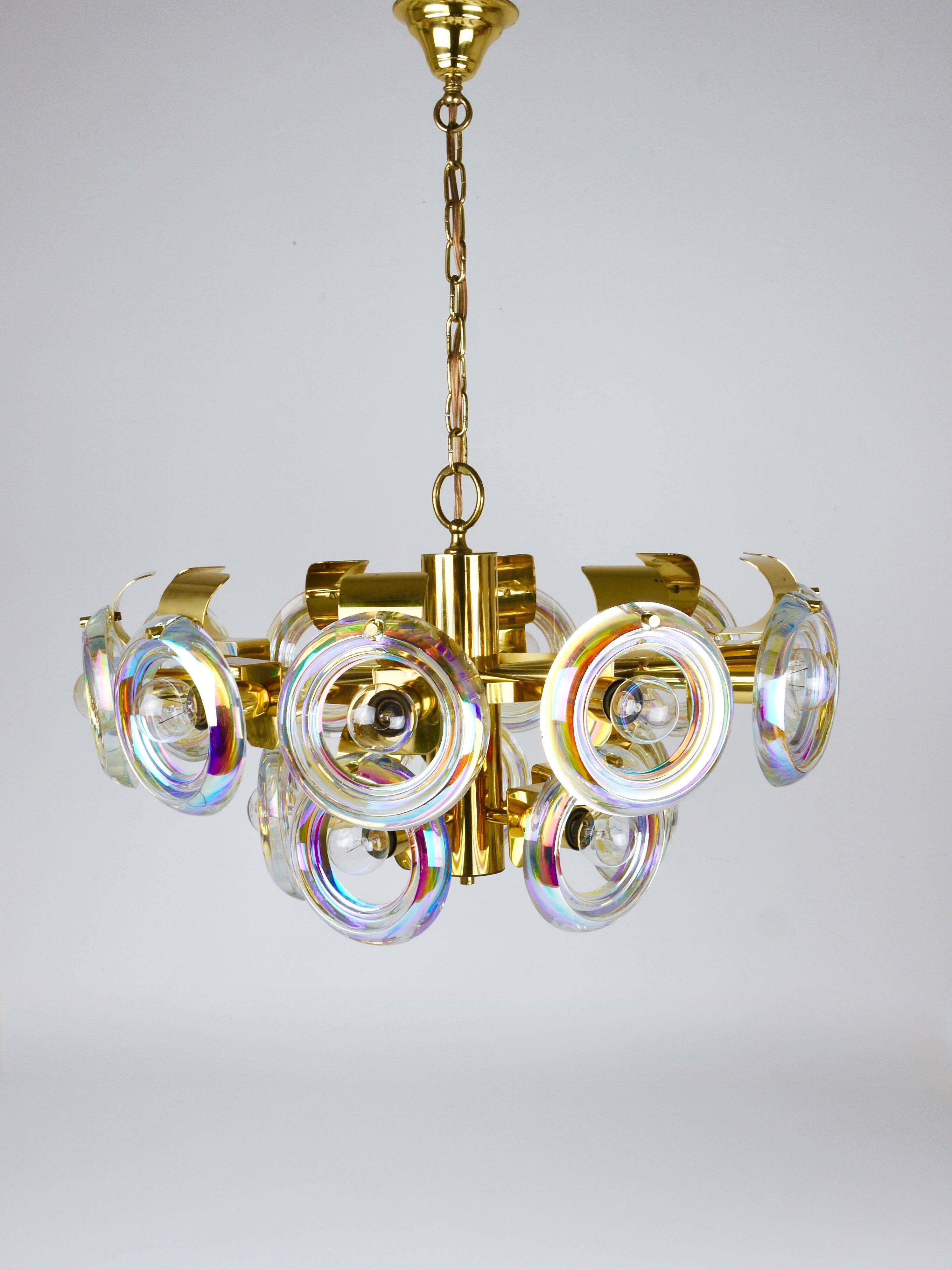 Large brass chandelier by Oscar Torlasco, rainbow optical glass rings, Italy, 1970s.