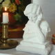 Limestone bust young girl who reads