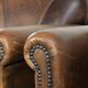Characterful set of two sheepskin design armchairs with beautiful patina