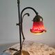 Brass articulated lamp with glass paste signed art of France.