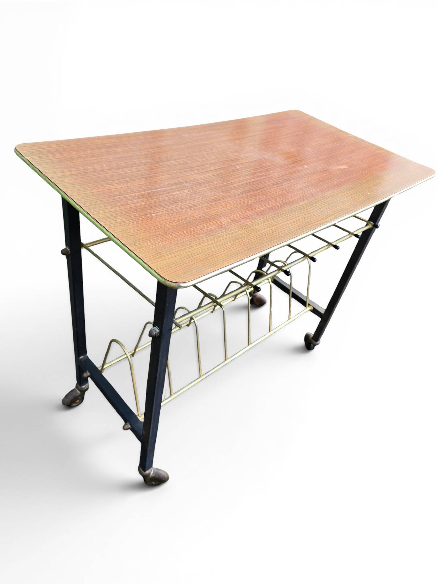 Vintage 1950s magazine table in metal and formica.