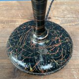Black table lamp with paint splatters from the 1920s