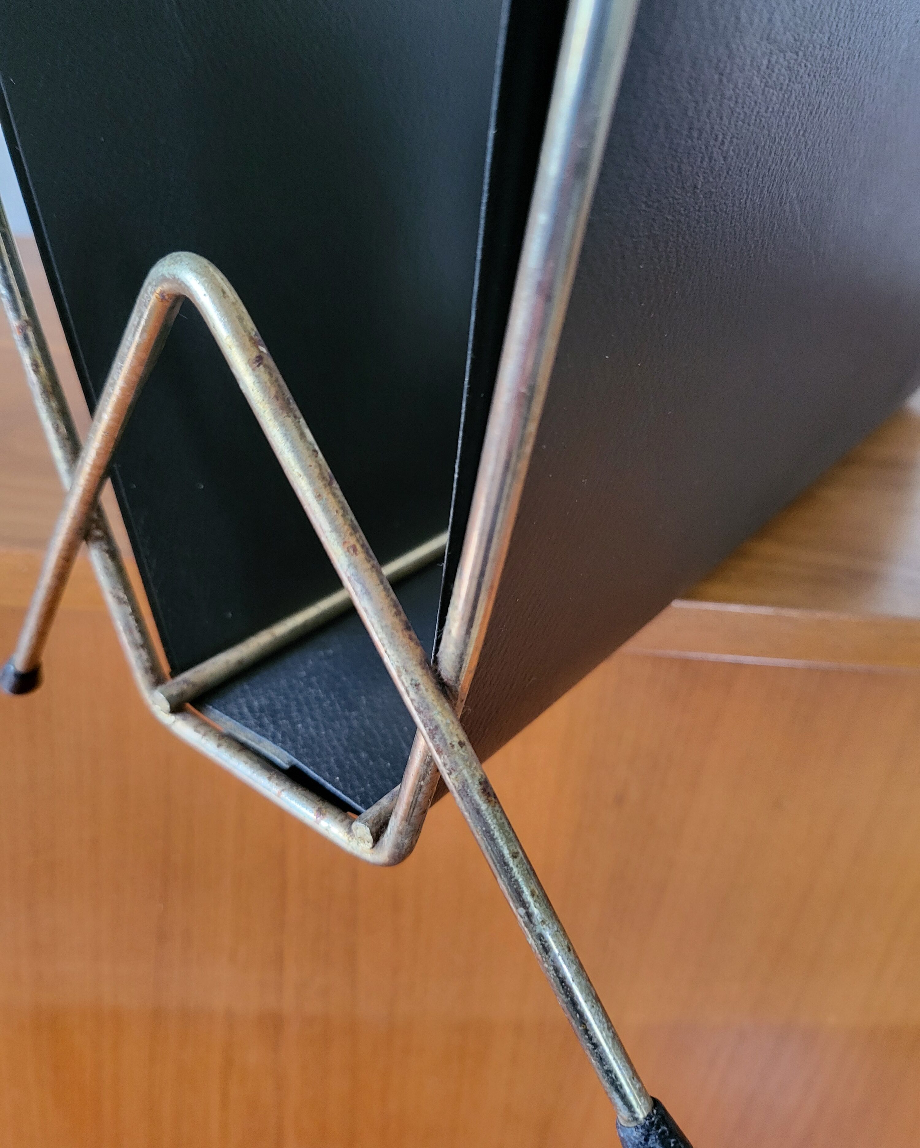 Vintage metal magazine rack in gold and black vinyl Newspaper holder