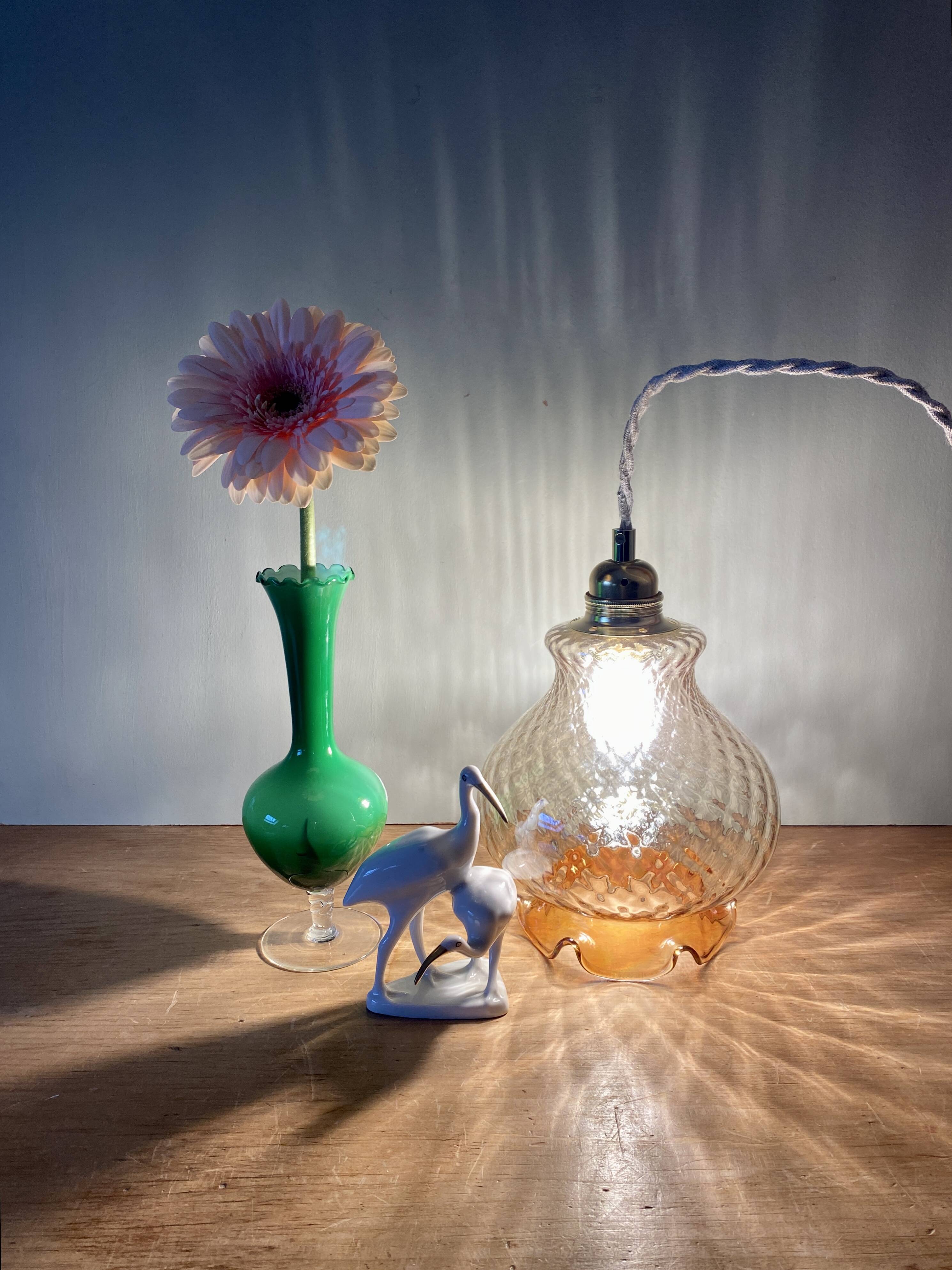 Vintage globe pendant light in amber glass