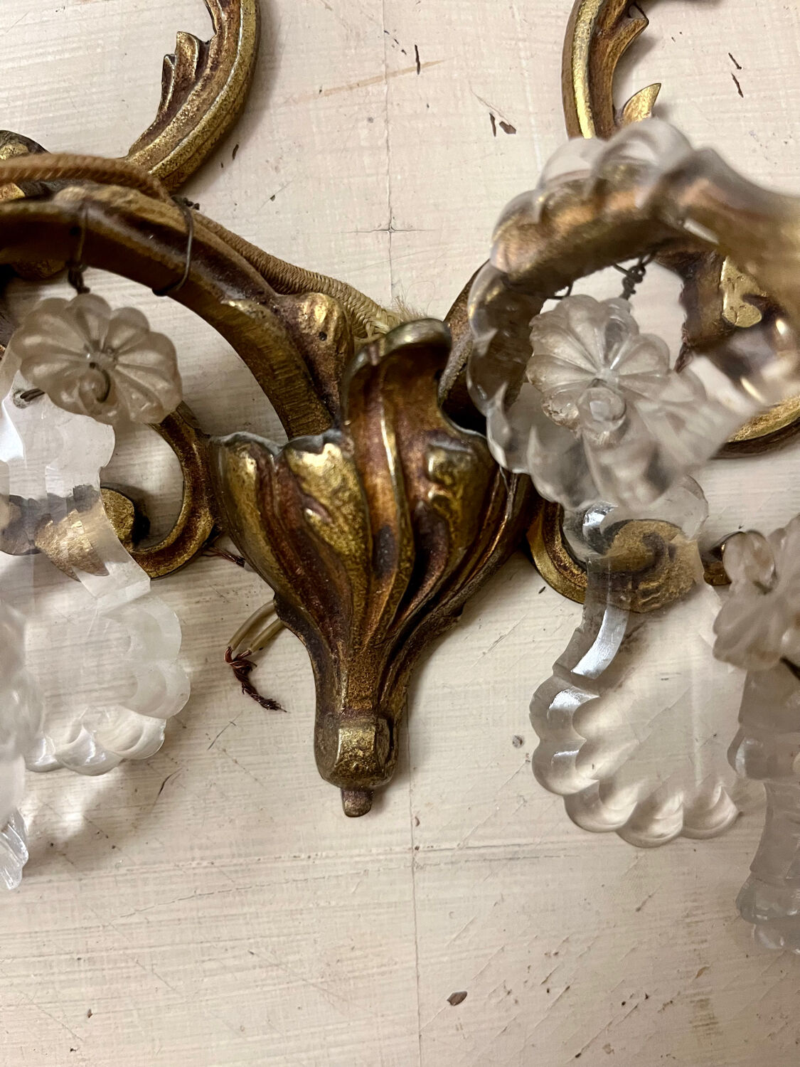 Louis XV style two-light bronze wall light with antique tassels