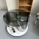 Vintage metal and smoked glass coffee table on casters bar