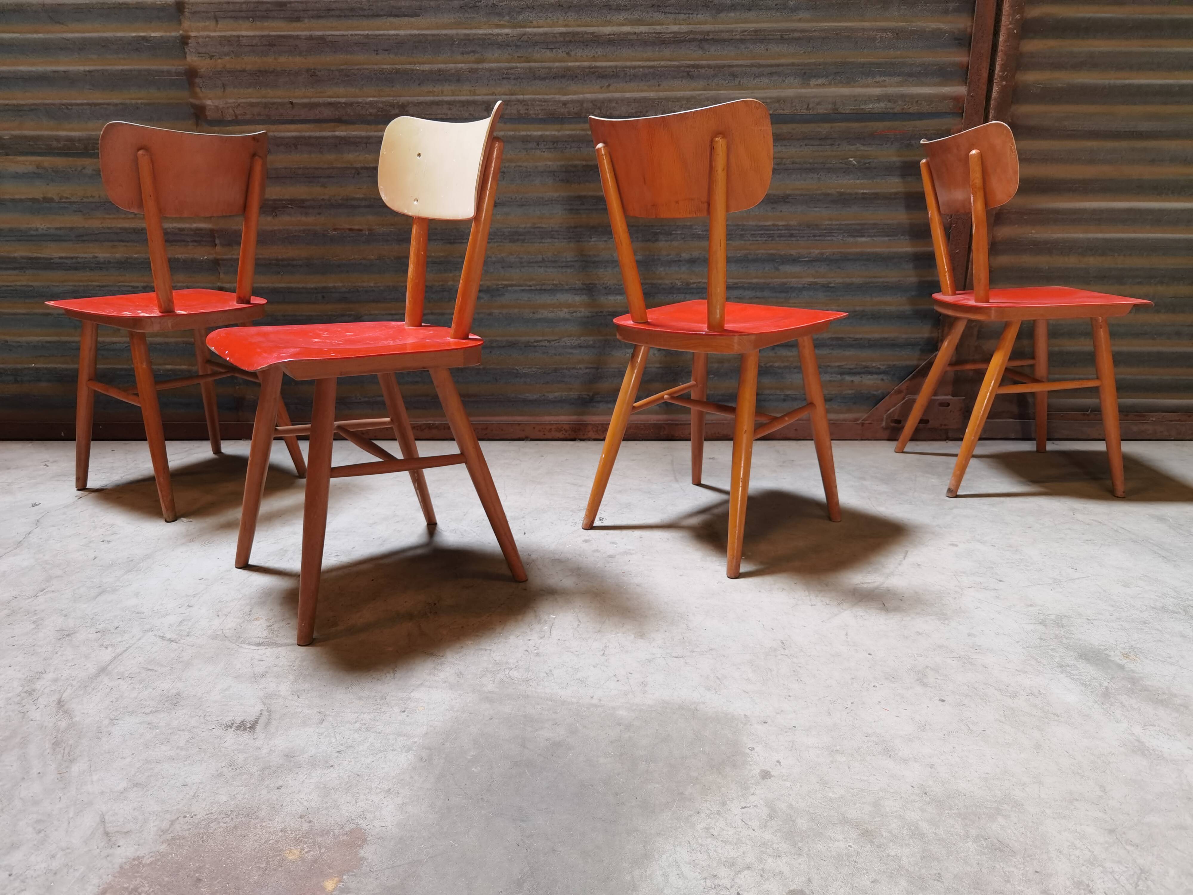 Set of 4 red wooden chairs published by Ton, 60s