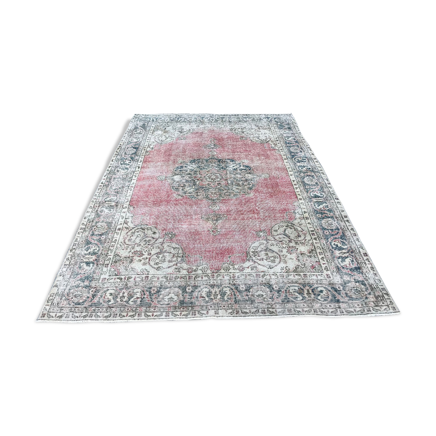 Pale pink rug with medallion
