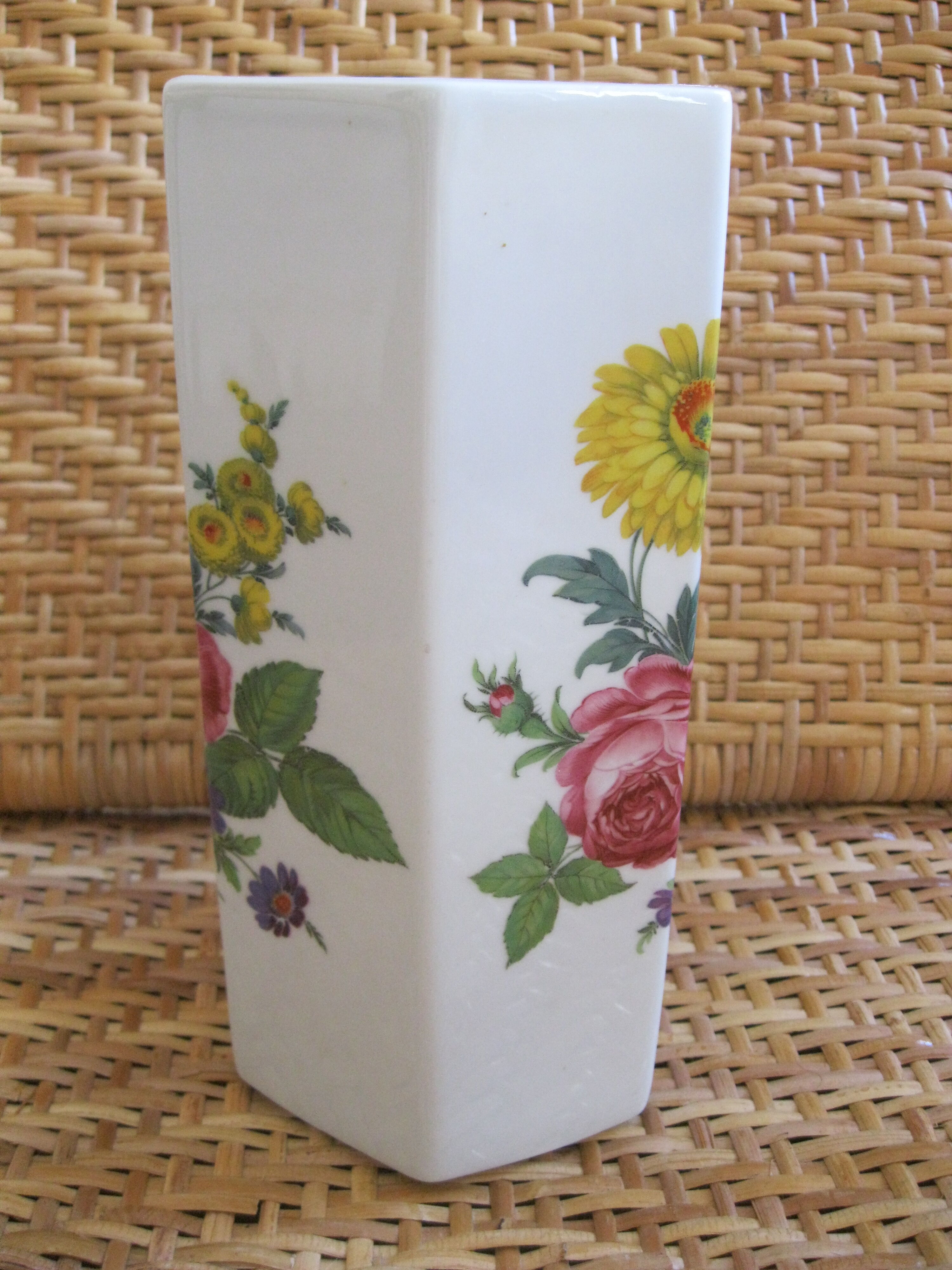 Flowery white porcelain faceted vase