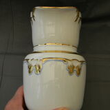 Milk jug or antique pitcher in white and gold porcelain.