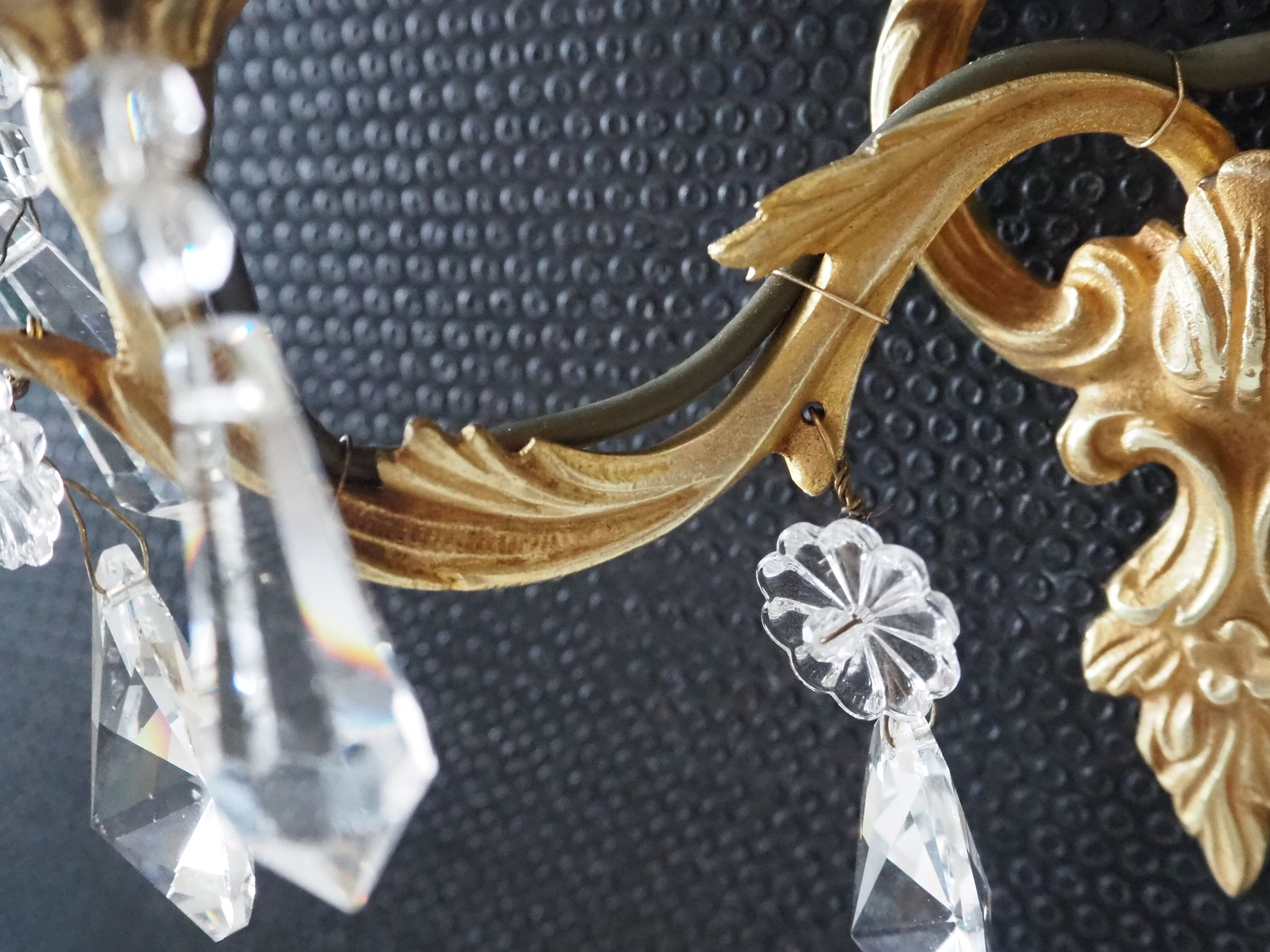 Pair of gilded bronze sconces and crystal pendants