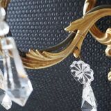 Pair of gilded bronze sconces and crystal pendants
