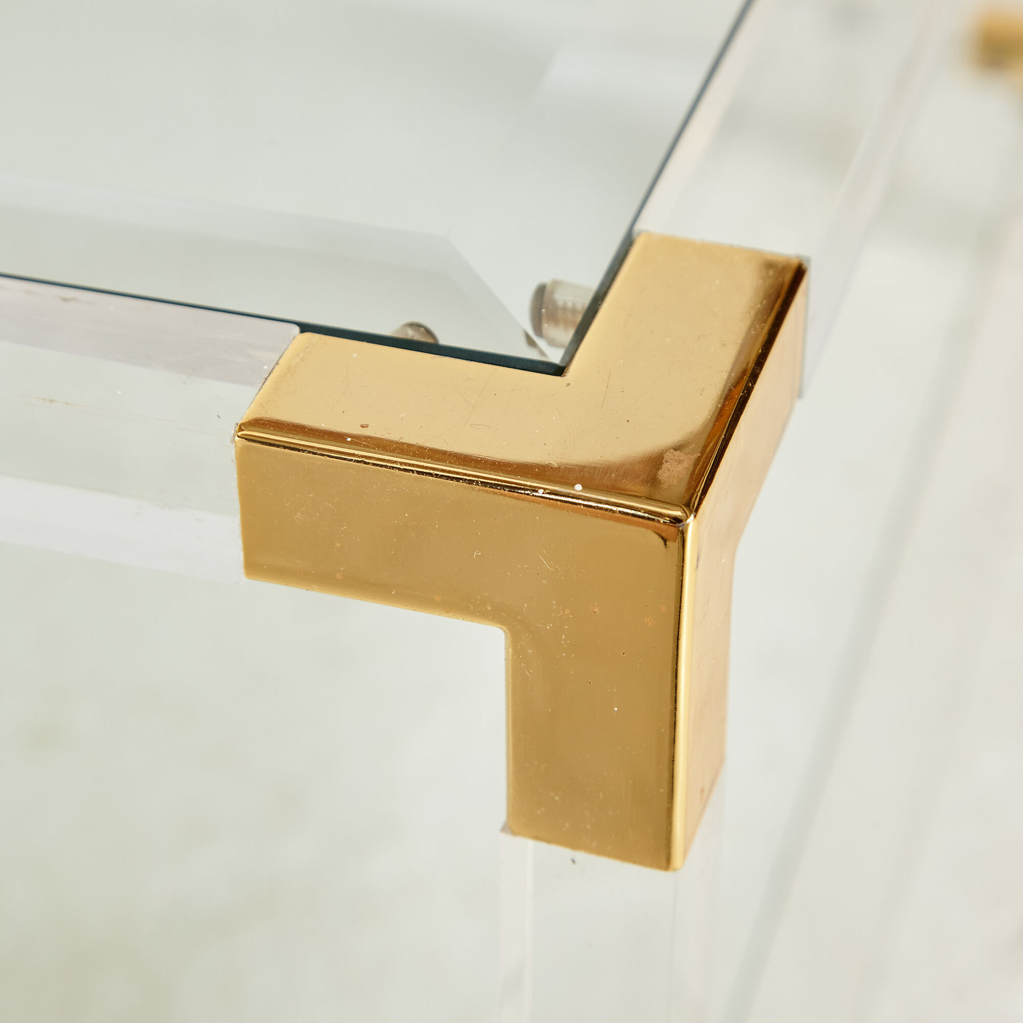 Glass and brass coffee table